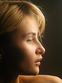Katya is a dreamy girl with kissable lips and blonde hair that shines in the sun, all naked.