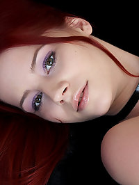 Redhead with fire in her soul shows her amazing assets from her breasts to her toes.
